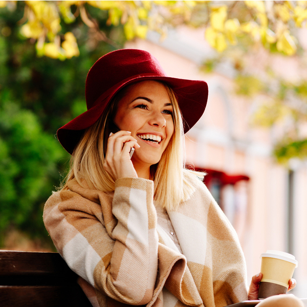 CEREC Young Woman on a Phone Outdoors