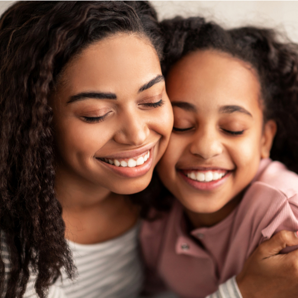 Dental Exams Mother and Daughter Hugging