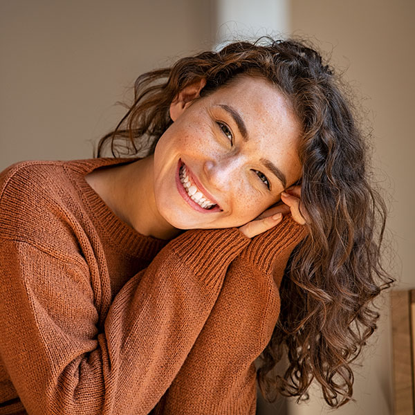 Digital X-Rays Girl with Freckles and Sweater Smiling Indoors