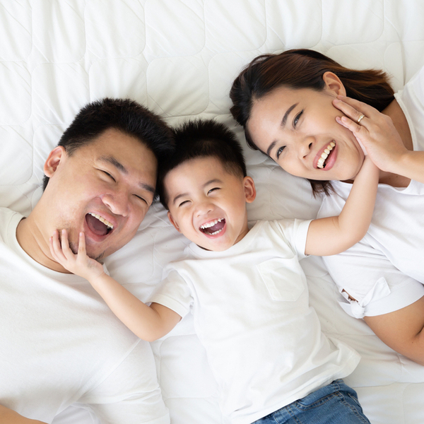 Oral Cancer Screenings Family of Three on Bed