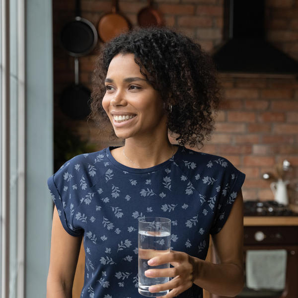 TMJ Treatment Woman with a Glass of Water